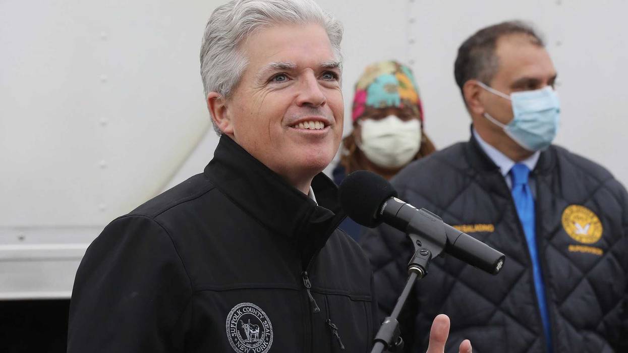 Suffolk County Executive Steve Bellone addresses the media as volunteers from Island Harvest Food Bank working in conjunction with the Nourish New York initiative distribute New York produced goods to people in need of food assistance on May 08, 2020 in Massapequa, New York.