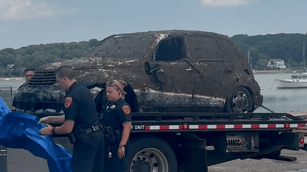 Suffolk County police were at Cedar Beach on Tuesday as divers searched a submerged vehicle believed to belong to a man who went missing in 2010