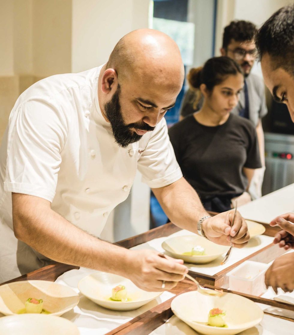 Sujan Sarkar working at Olive Bar and Kitchen in New Delhi. Sarkar said his years of experience in cities that include London, New Delhi, New York City and Dubai all fed into his decision to open Indienne in Chicago