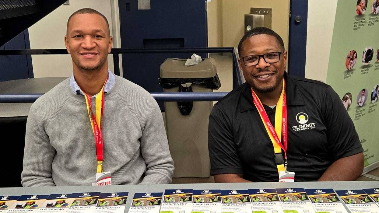 Summit Academy OIC admissions recruiters Shawn Forcha (left) and Bukwon Holland at a recent recruiting event at the Scott County Jail in Shakopee, Minnesota.