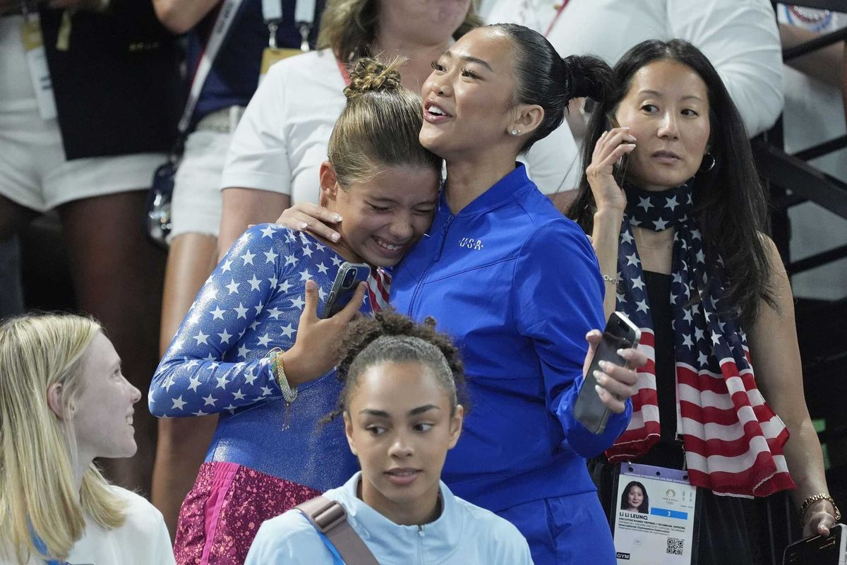 Sunisa Lee of the United States poses for a photo with fans.