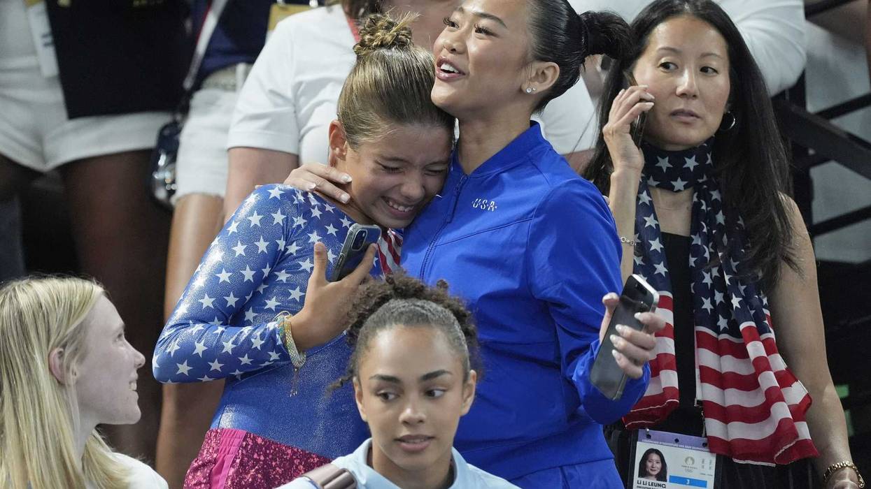 Sunisa Lee of the United States poses for a photo with fans.