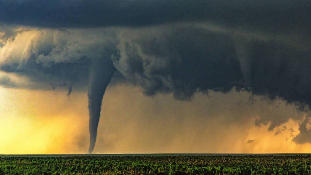 Sunset tornado at sunset in rural area