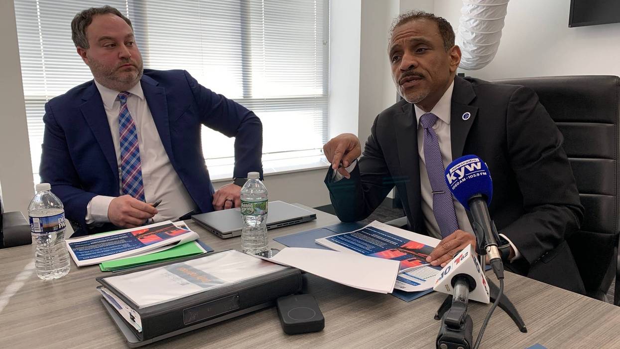 Superintendent Tony Watlington and Chief Financial Officer Mike Herbstman speak to reporters prior to Thursday's school board meeting.