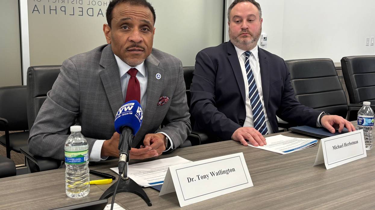 Superintendent Tony Watlington (left) and Philadelphia School District CFO Mike Herbstman brief reporters on plans to slash millions in spending to balance next year's budget.