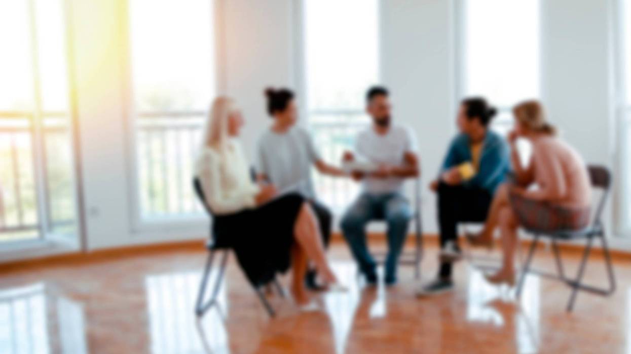 Support group meets in a sun-filled room. Image blurs our individual faces