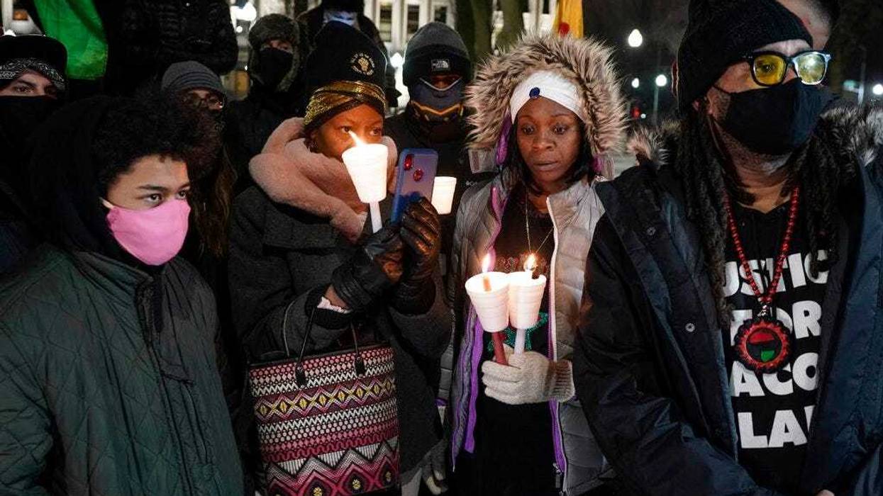 Supporters hold candles at a rally for Jacob Blake, Monday, Jan. 4, 2021, in Kenosha, Wis. Kenosha Police Officer Rusten Sheskey opened fire on Blake in August after responding to a domestic dispute, leaving him paralyzed.