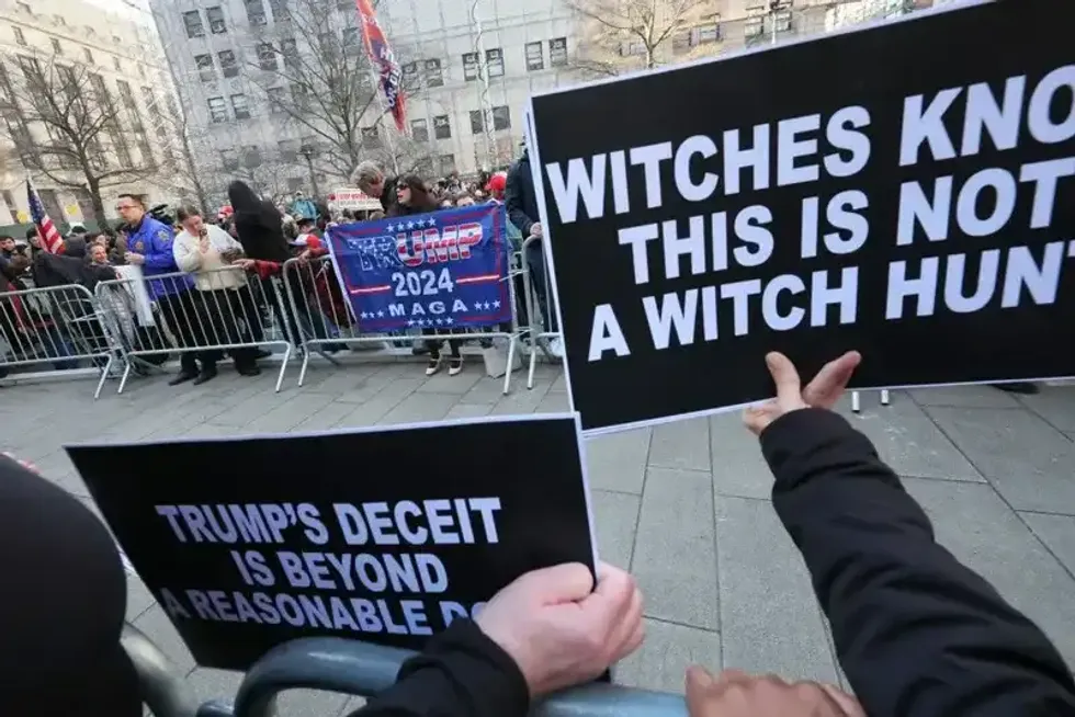 Supporters of former President Donald Trump and counter-protestors are separated as they hold rallies at Collect Pond Park near the courthouse ahead of his arraignment hearing on April 04, 2023, in New York City.