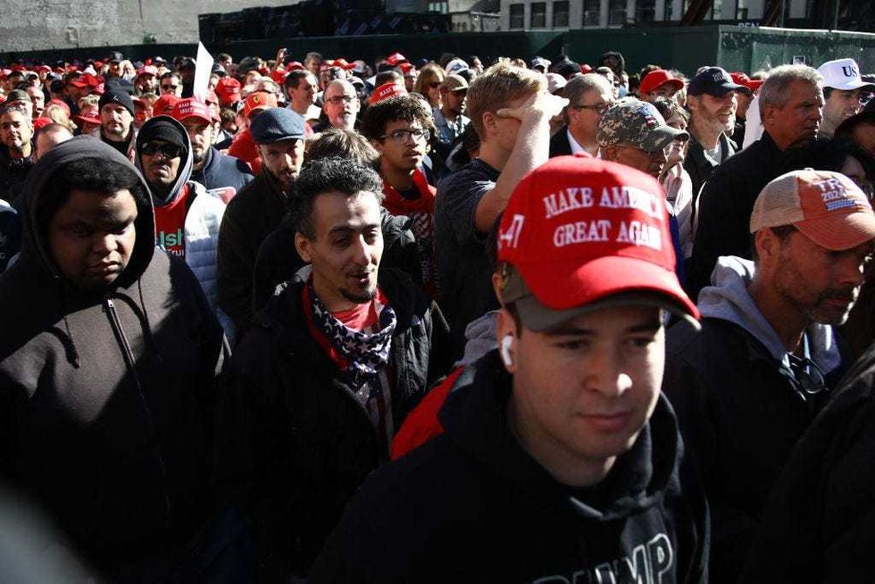 Supporters of former U.S. president and Republican presidential candidate Donald Trump arrive for a campaign rally at Madison Square Garden in New York on Oct. 27, 2024.
