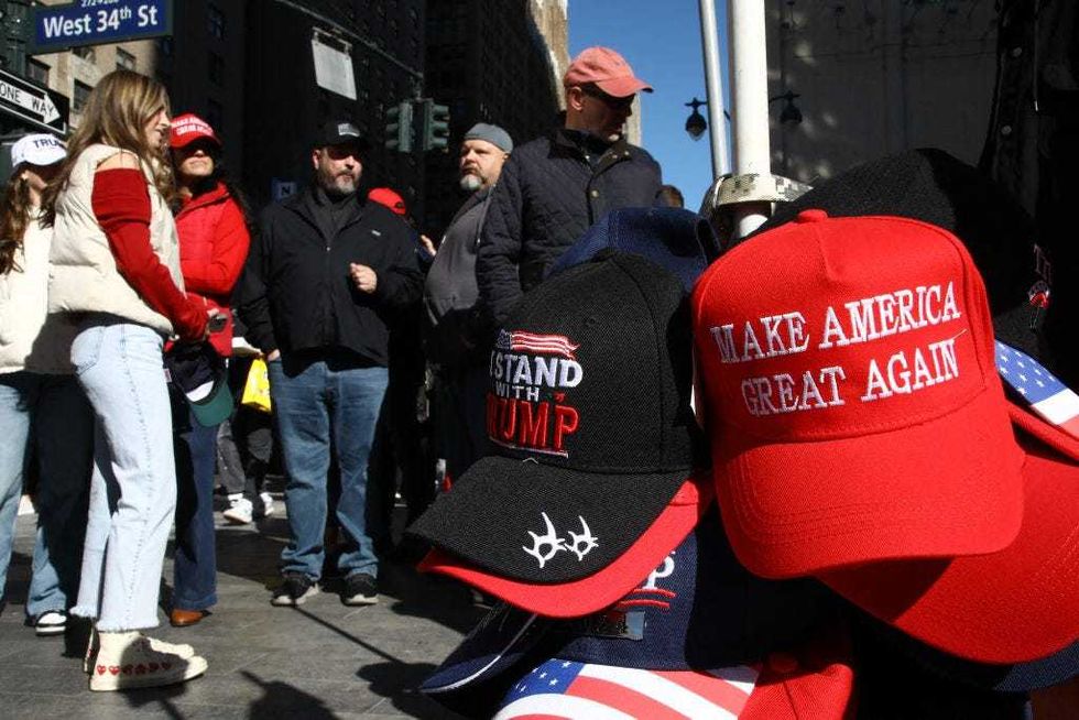 Supporters of former U.S. President and Republican presidential candidate Donald Trump arrive for a campaign rally at Madison Square Garden in New York, Oct. 27, 2024.