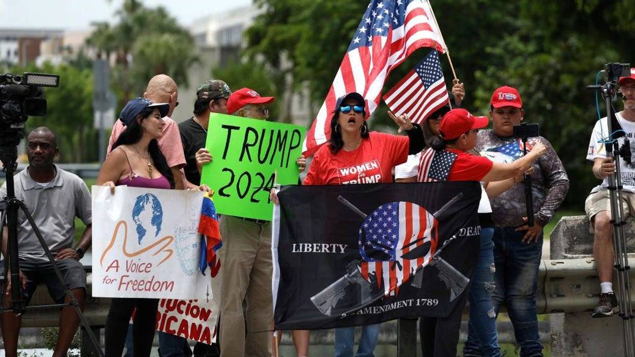 Supporters of former U.S. President Donald Trump protest outside of Trump National Doral resort as they await his arrival on June 12, 2023 in Doral, Florida.