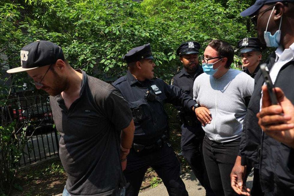 Supporters of Jordan Neely are arrested by NYPD officers during a rally in support of Daniel Penny at Collect Pond Park on May 24, 2023 in New York City.