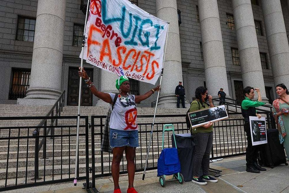 Supporters of Luigi Mangione gather outside a federal court in Manhattan as the murder suspect is set to appear for the arraignment on charges that he murdered UnitedHealthcare CEO Brian Thompson late last year on April 25, 2025 in NYC.
