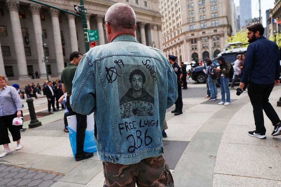 Supporters of Luigi Mangione gather outside a federal court in Manhattan as the murder suspect is set to appear for the arraignment on charges that he murdered UnitedHealthcare CEO Brian Thompson late last year on April 25, 2025 in NYC.