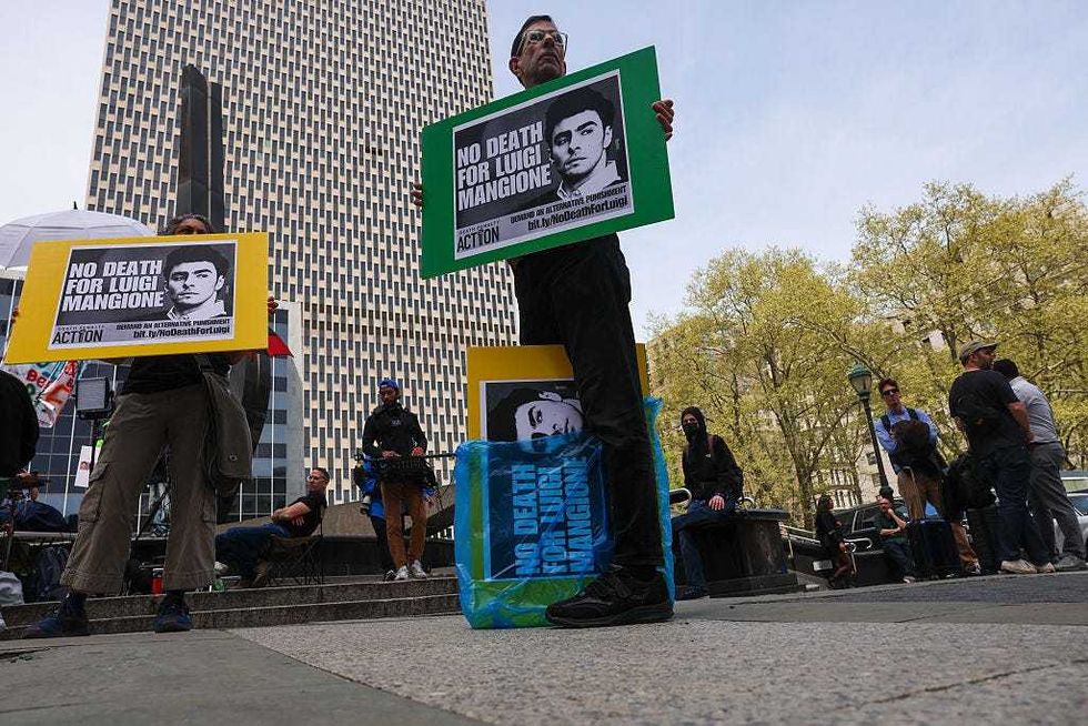 Supporters of Luigi Mangione gather outside a federal court in Manhattan as the murder suspect is set to appear for the arraignment on charges that he murdered UnitedHealthcare CEO Brian Thompson late last year on April 25, 2025 in NYC.