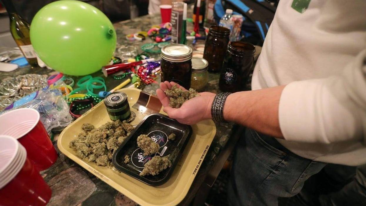 Supporters of Proposition 1 party as results come in Tuesday, Nov. 6, 2018 in Detroit, Mich.