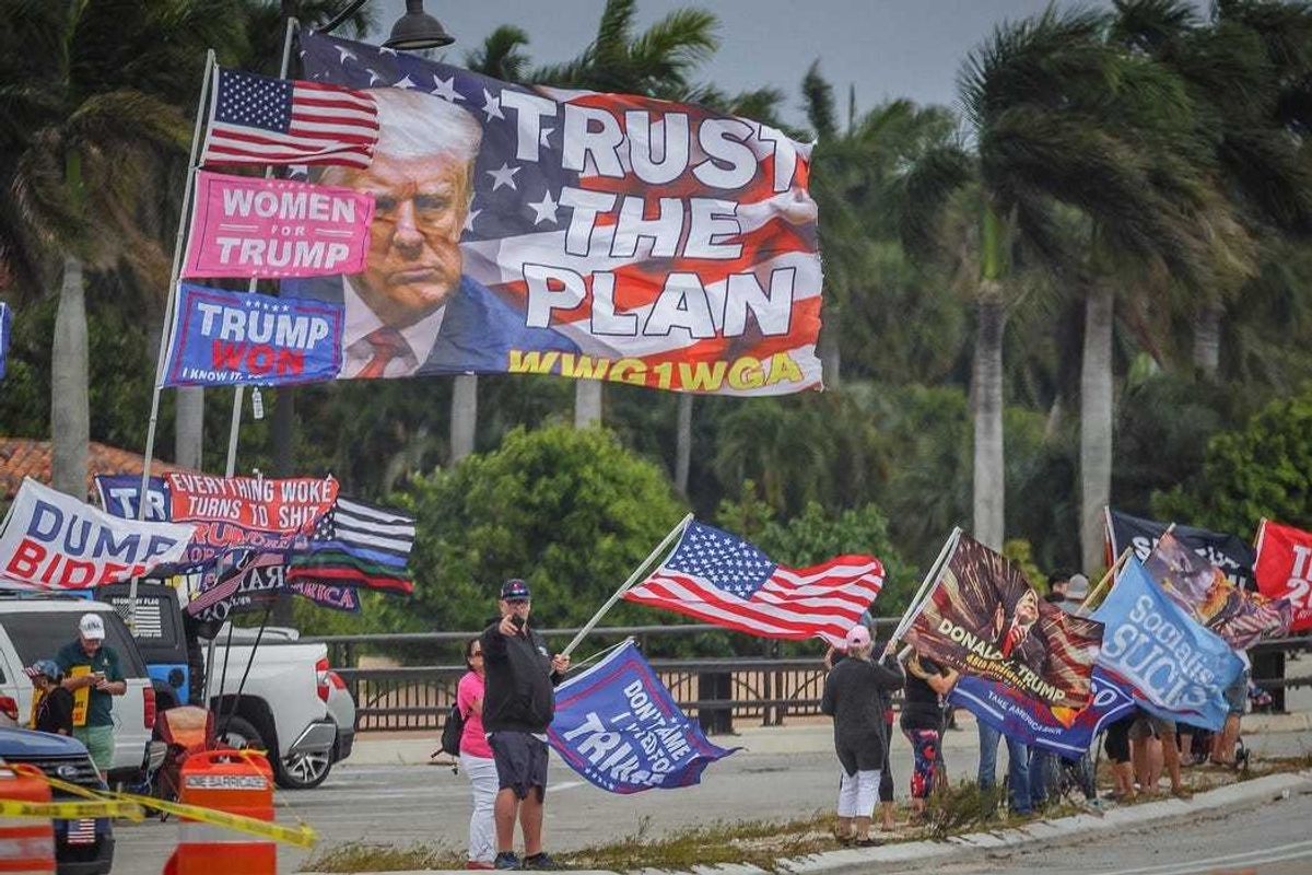 Supporters of the former President Donald Trump congregate just west of Mar-a-Lago on Southern Boulevard in Palm Beach, Fla., on March 19, 2023. Trump called for supporters to protest after claiming that he will be arrested on Tuesday following the Manhattan district attorney's investigation into hush money paid to Stormy Daniels in 2016.