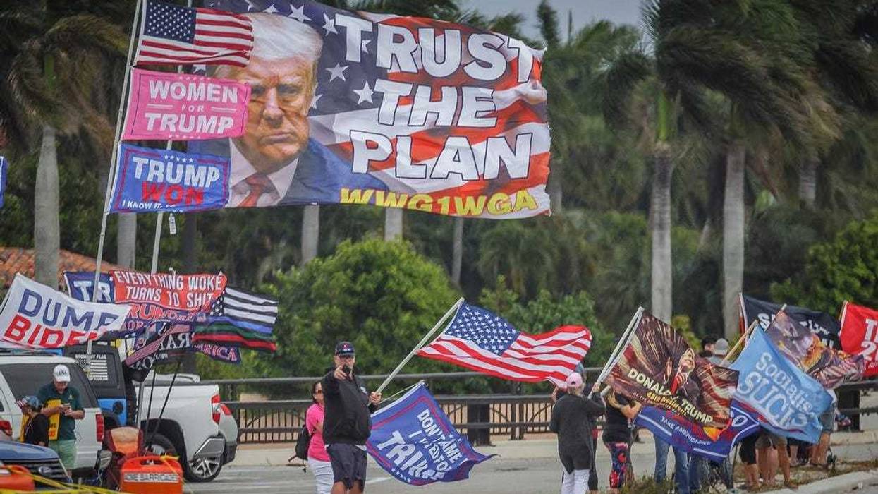 Supporters of the former President Donald Trump congregate just west of Mar-a-Lago on Southern Boulevard in Palm Beach, Fla., on March 19, 2023. Trump called for supporters to protest after claiming that he will be arrested on Tuesday following the Manhattan district attorney's investigation into hush money paid to Stormy Daniels in 2016.