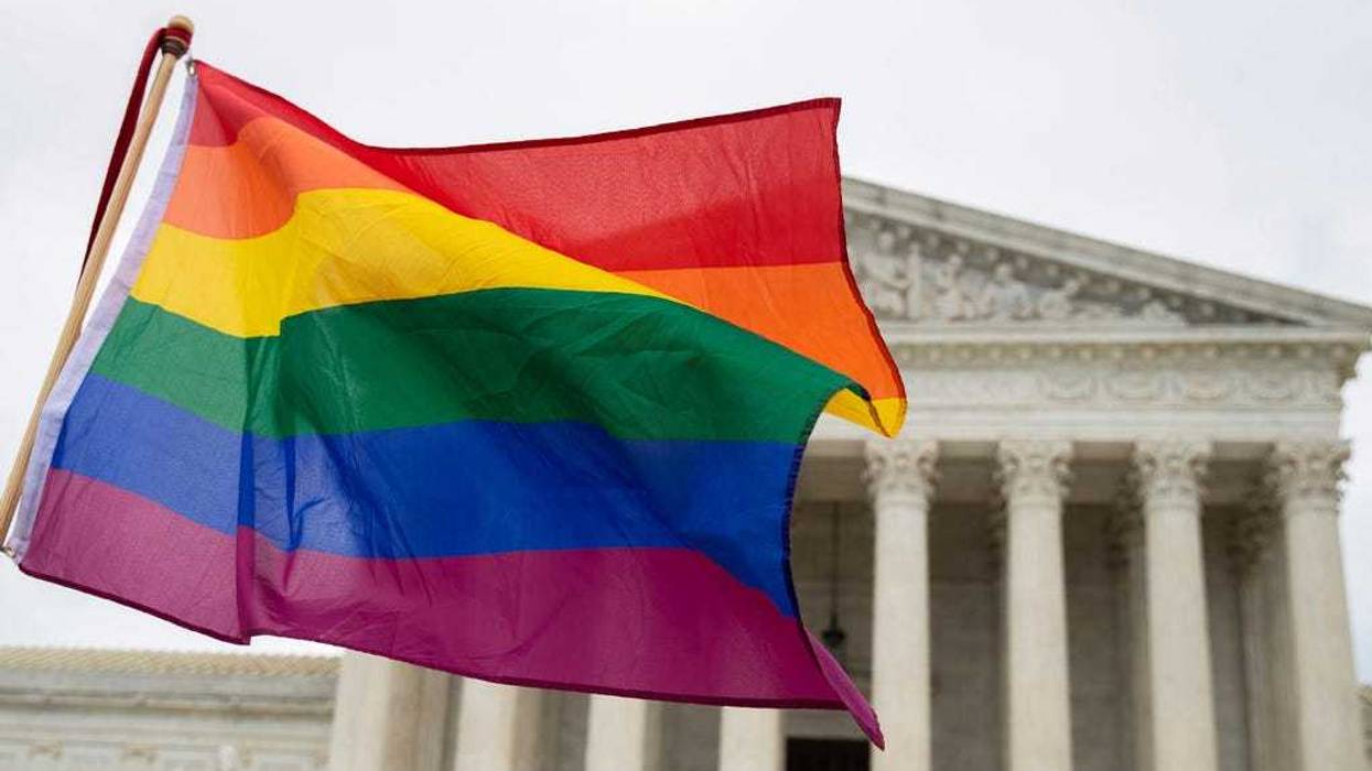 Supporters of the LGBT wave their flag in front of the U.S. Supreme Cour, Oct. 8, 2019, in Washington.