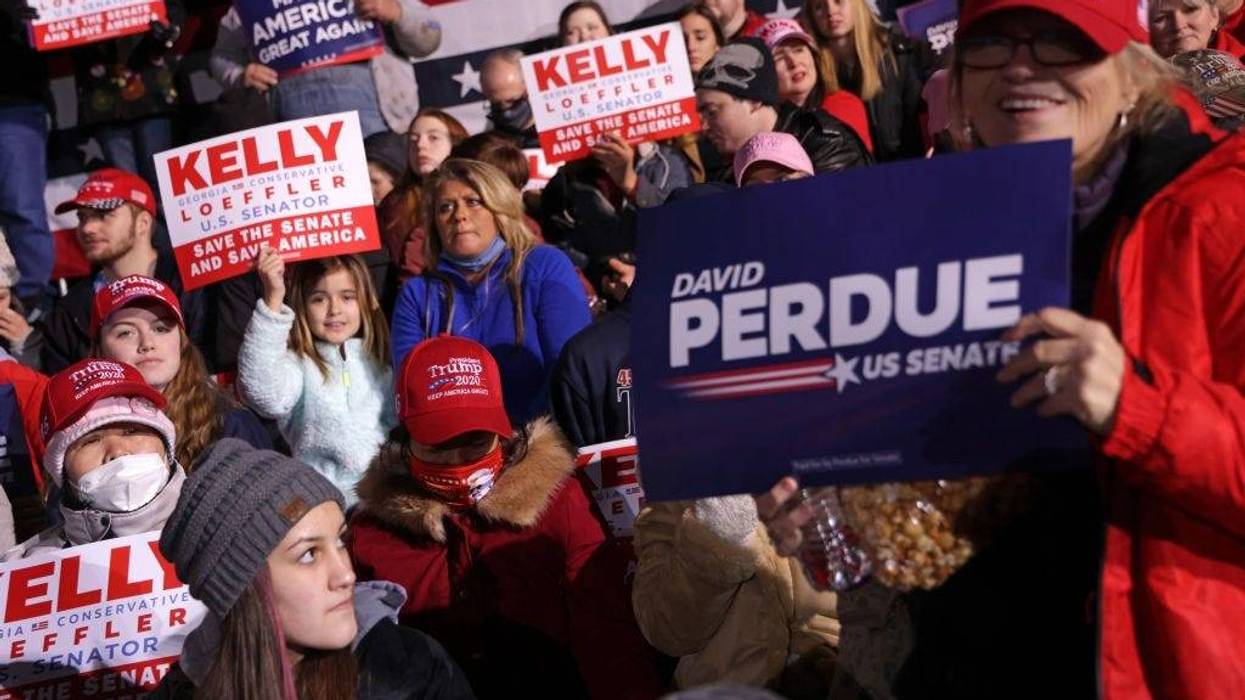 Supporters participate in a Republican National Committee Victory Rally at Dalton Regional Airport January 4, 2021 in Dalton, Georgia. President Trump campaigned for the two incumbents, Sen. David Perdue (R-GA) and Sen. Kelly Loeffler (R-GA).