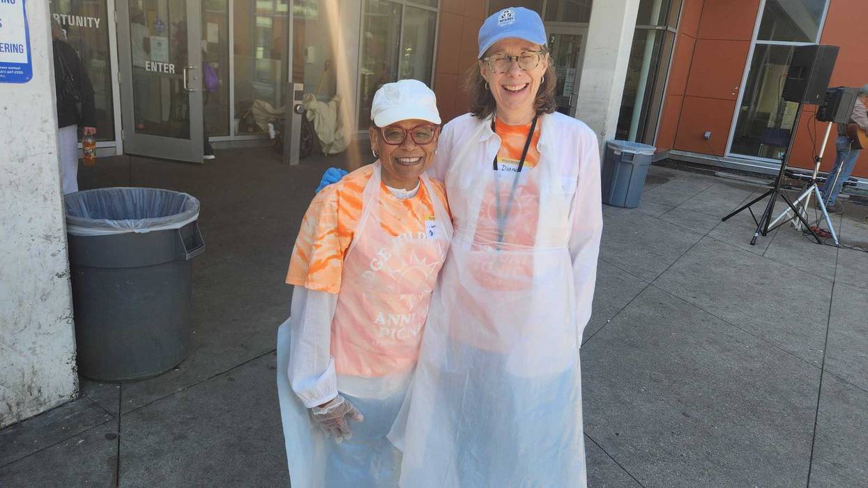 Supreme Court chief justice Natalie Hudson and Appeals Court judge Diane Bratvold who helped out at the annual Memorial Day Picnic in St. Paul on Friday.