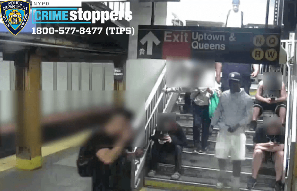 Surveillance footage shows the suspect walking down a crowded staircase at the station around the time of the attack