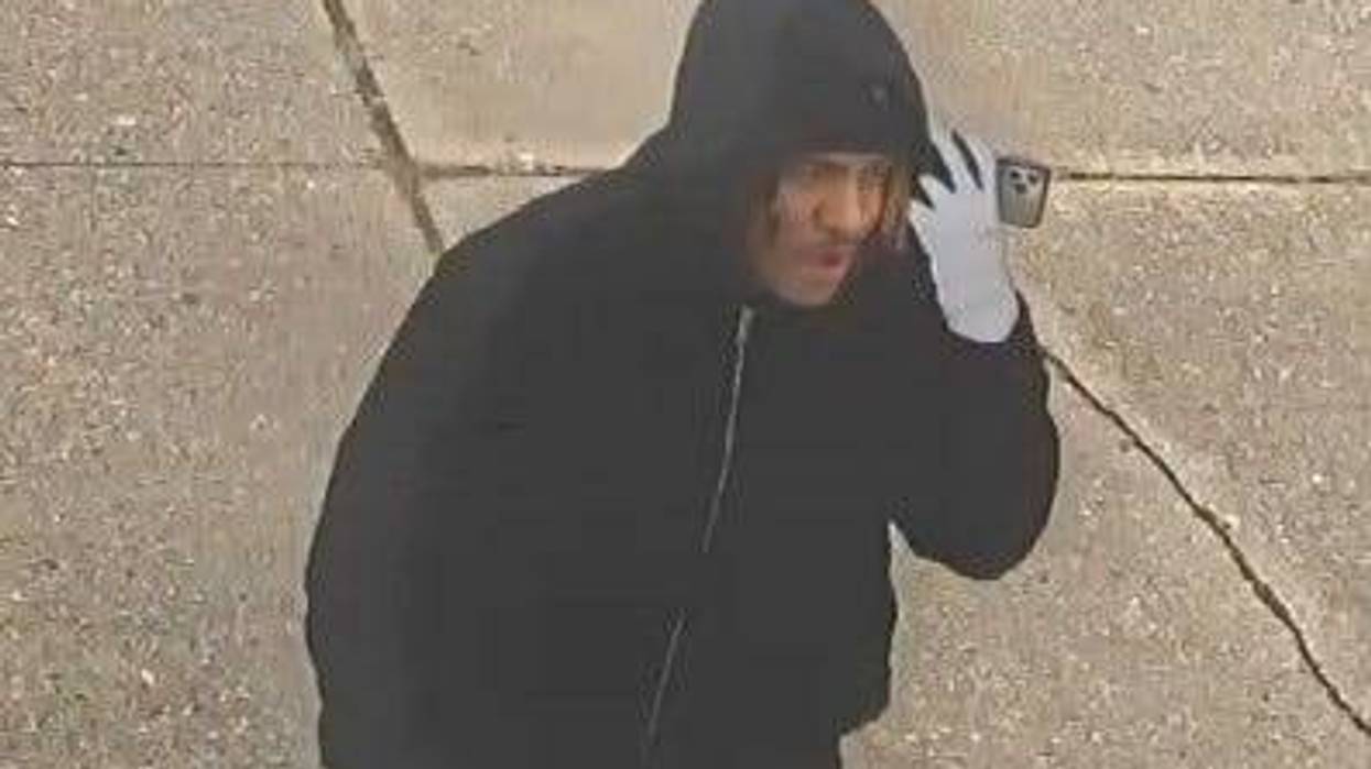 surveillance image of man talking on phone