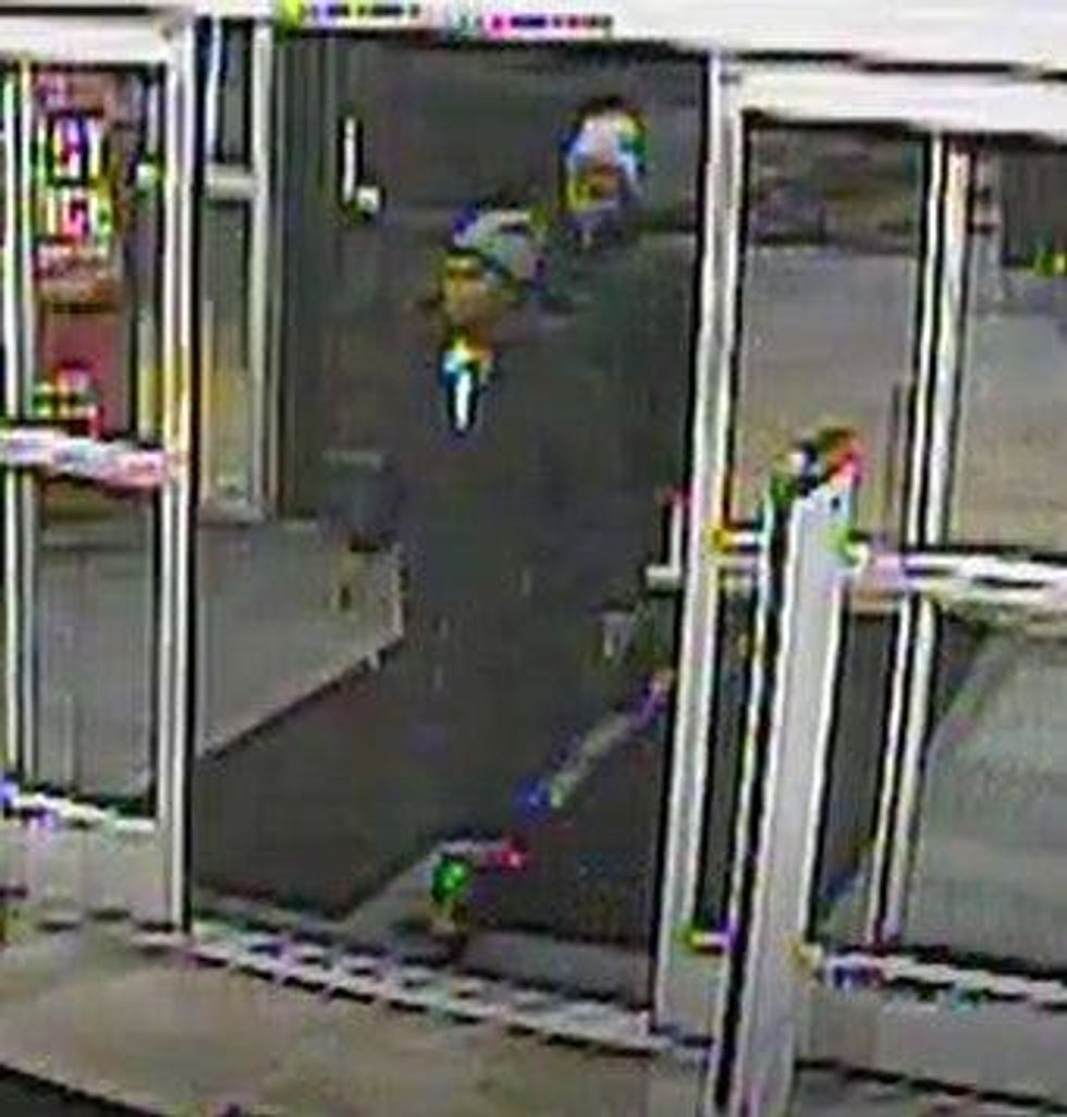 Surveillance photo of two men wanted in connection with a robbery at Dick