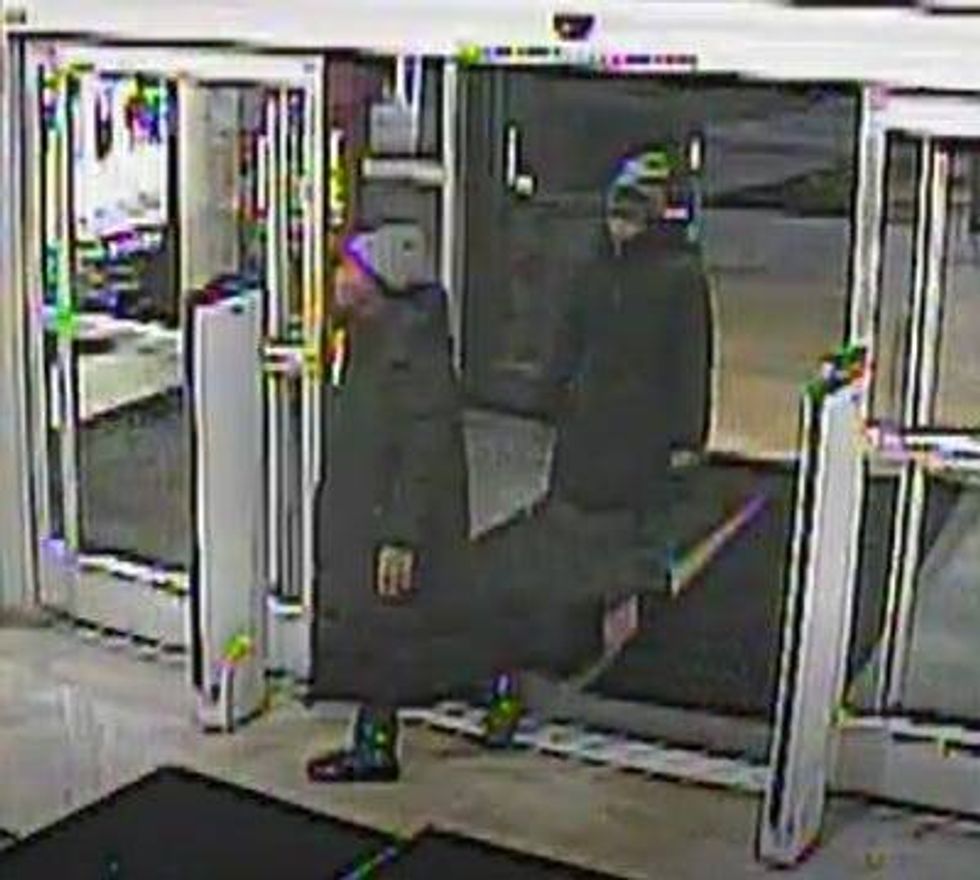 Surveillance photo of two men wanted in connection with a robbery at Dick