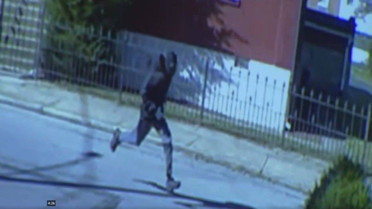 Surveillance video of a suspect running from the scene of a Coatesville school bus shooting