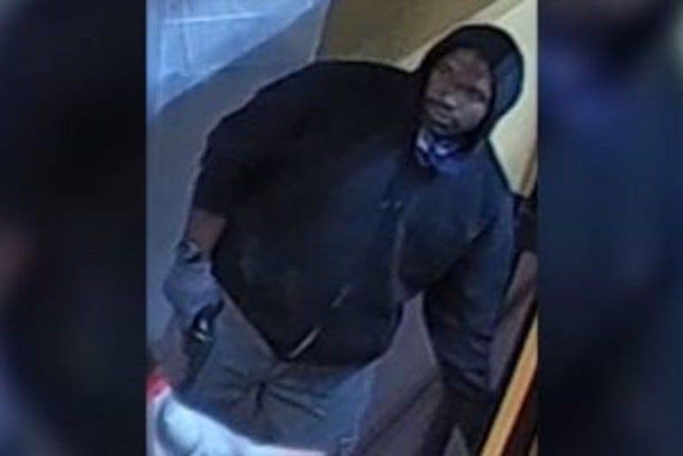 Surveillance video screenshot of a man who police say robbed a Dunkin