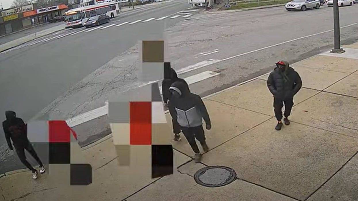Surveillance video shows four males surround Devin Weedon and a friend (blurred).