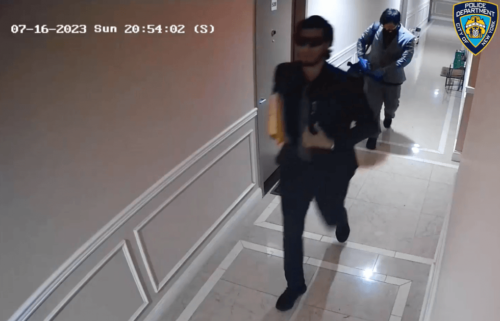 Surveillance video shows the two suspects walking down a hallway