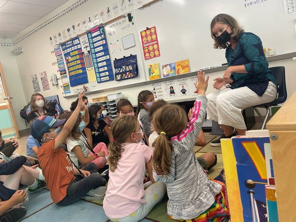 Susi Brennnan instructs first graders at Daniel Webster Elementary School in mindfulness meditation on Wednesday, Sept. 8, 2021.