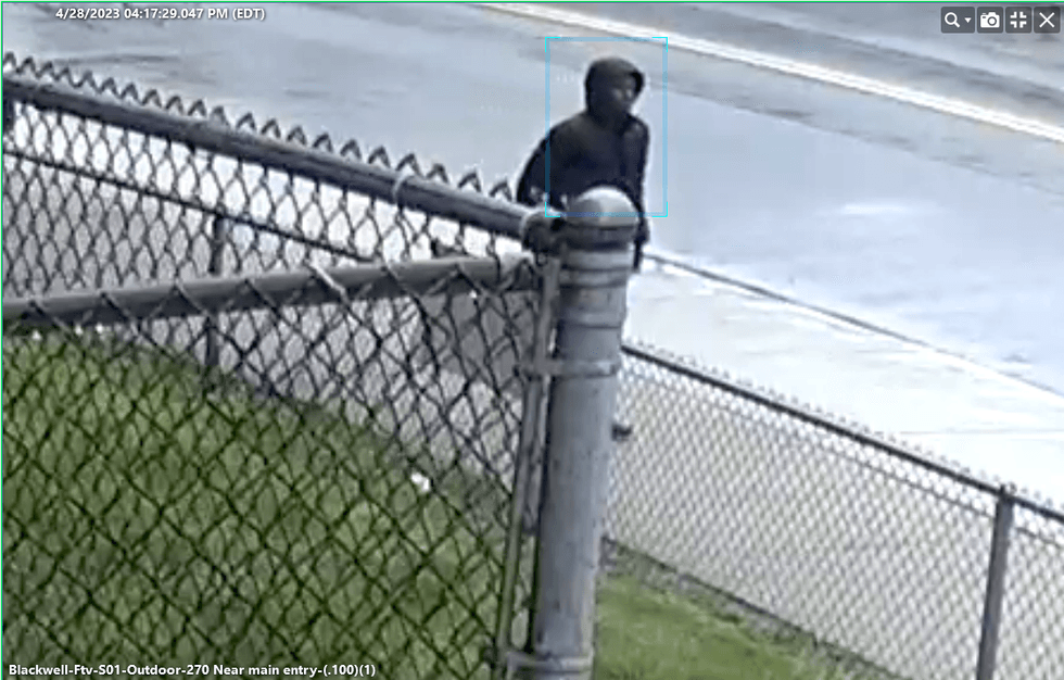 Suspect in Detroit shooting walking on the sidewalk