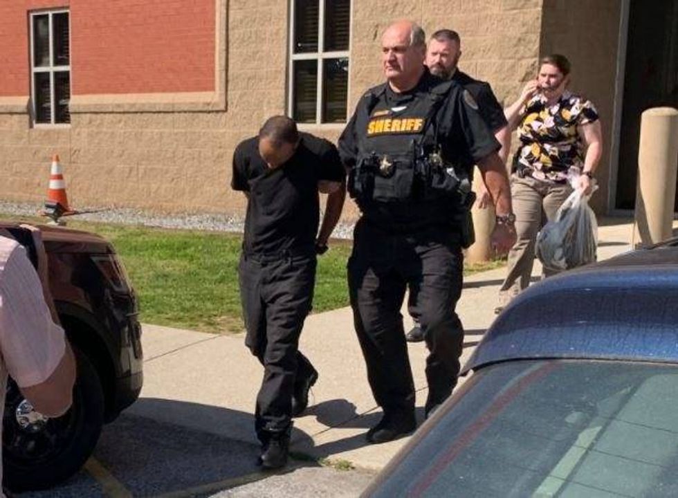 Suspect Jamaal Harvey is transported to ACSO vehicle