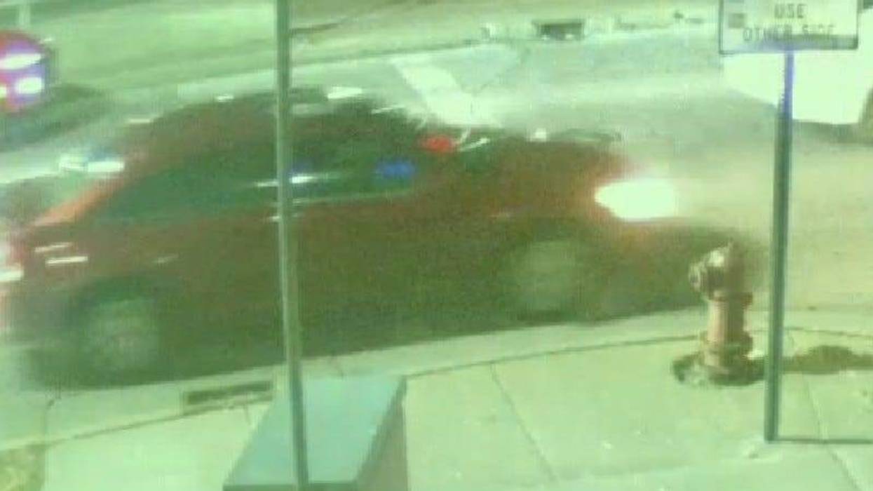 Suspect's red sedan