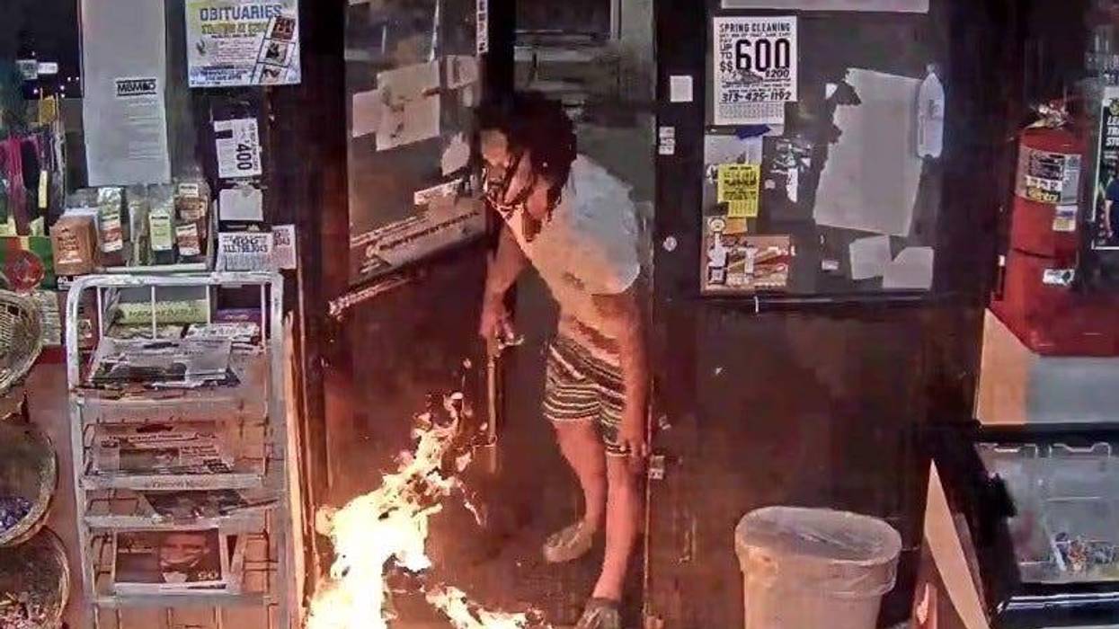 Suspect sets fire inside Detroit gas station