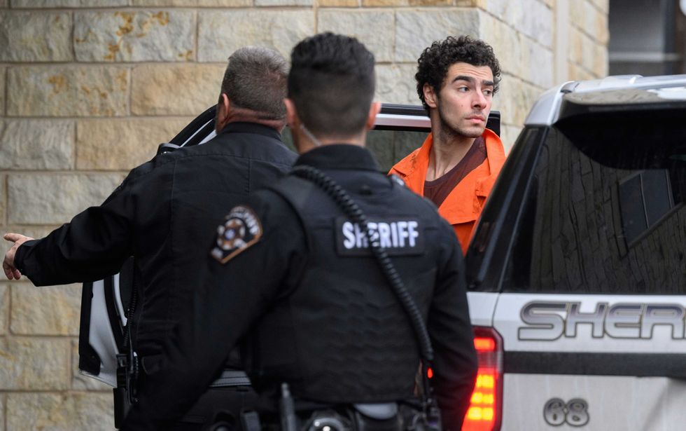 Suspected shooter Luigi Mangione is led into the Blair County Courthouse for an extradition hearing December 10, 2024