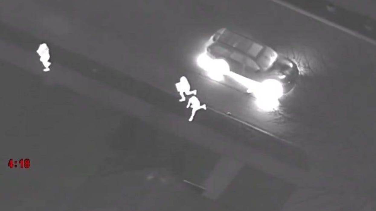 Suspects running from SUV