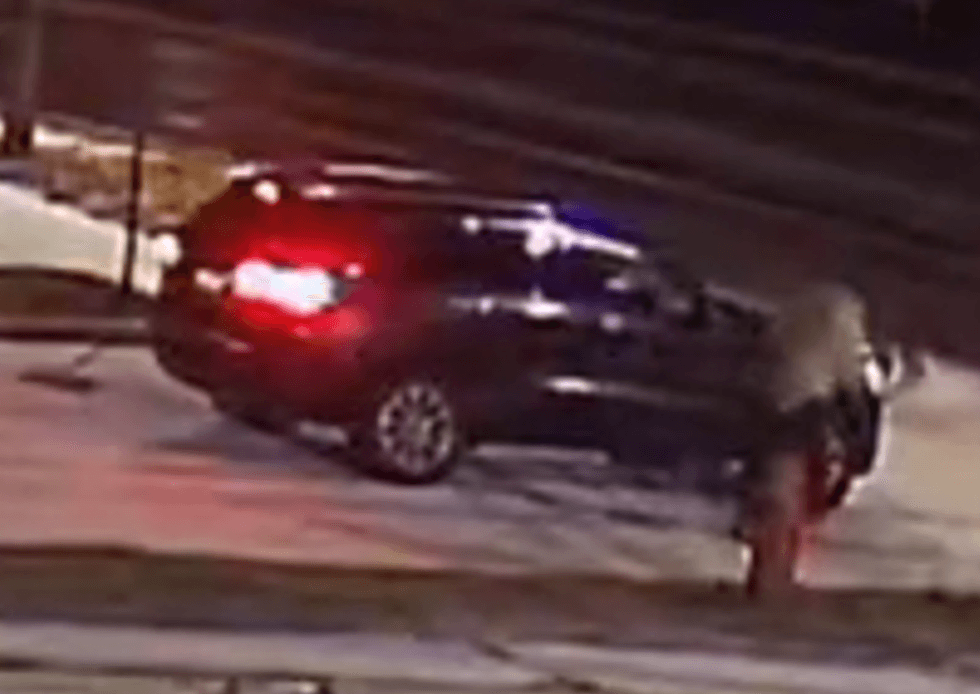 SUV driving on snowy road