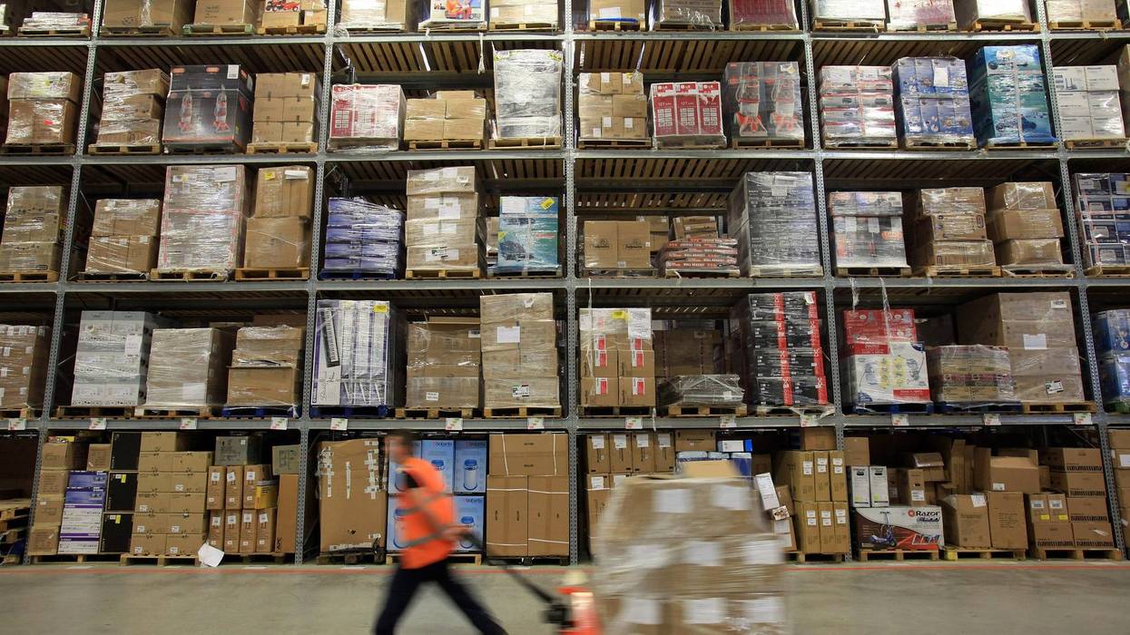 SWANSEA, WALES - NOVEMBER 26: Staff at the Amazon Swansea fulfilment centre process orders as they prepare for what is expected to be their busiest Christmas on record on November 26, 2010 in Swansea, Wales.