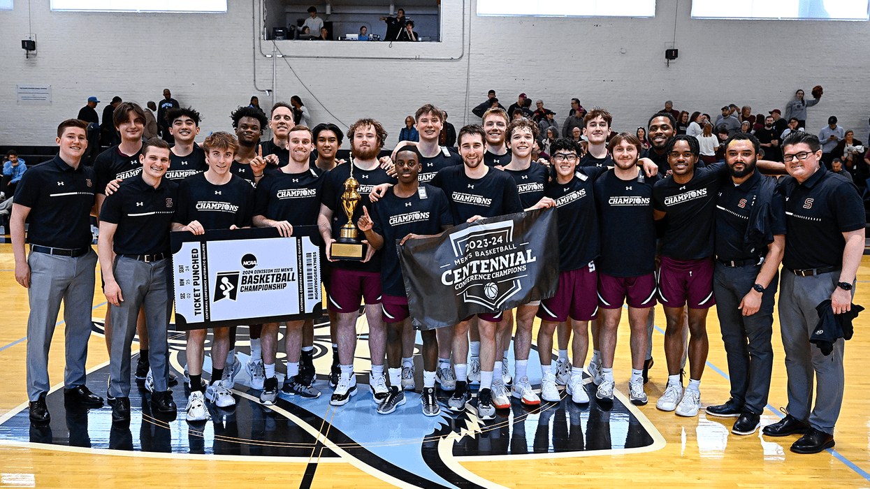 Swarthmore College's men's basketball team celebrates winning the Centennial Conference title.