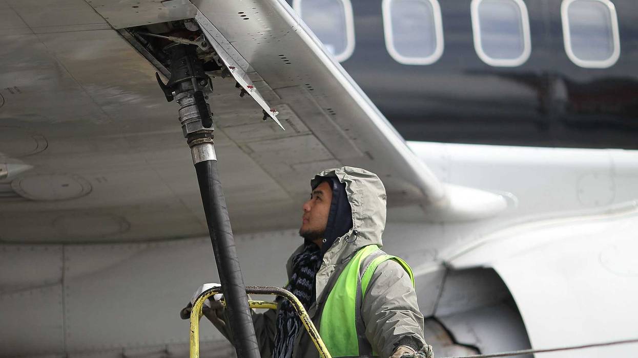 Swissport employee refueling an airplane in 2011.