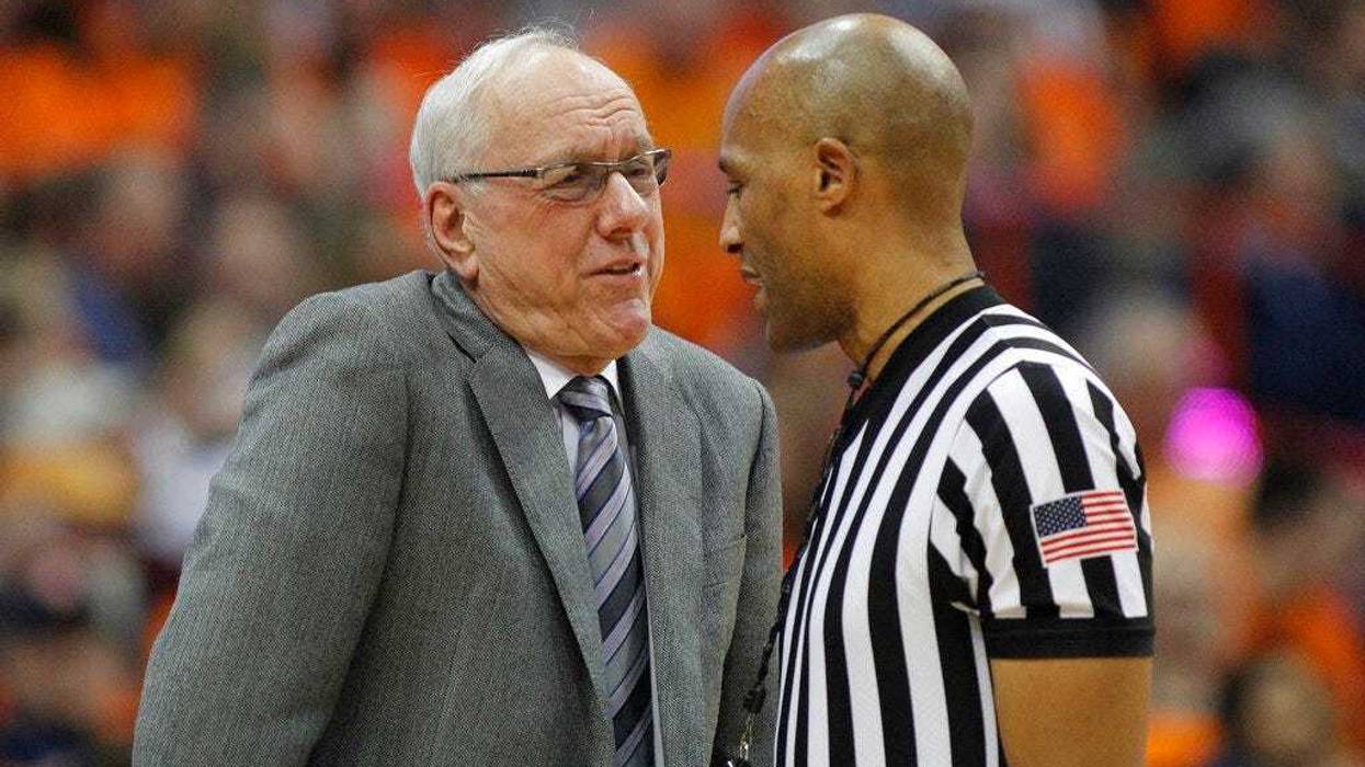 Syracuse head coach Jim Boeheim, left, talks to an official about a call during the second half of an NCAA college basketball game against Louisville in Syracuse, N.Y., Wednesday, Feb. 20, 2019. Syracuse won 69-49. (AP Photo/Nick Lisi)