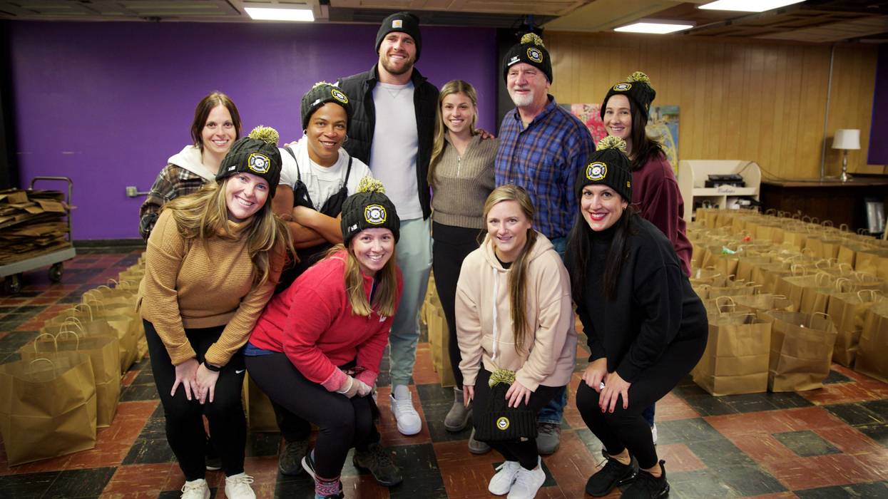 T.J. Watt and his wife with 412 Food Rescue staff