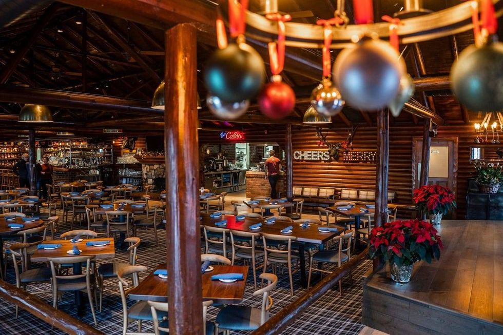 Tables sit ready for guests in the main dining room at Karl