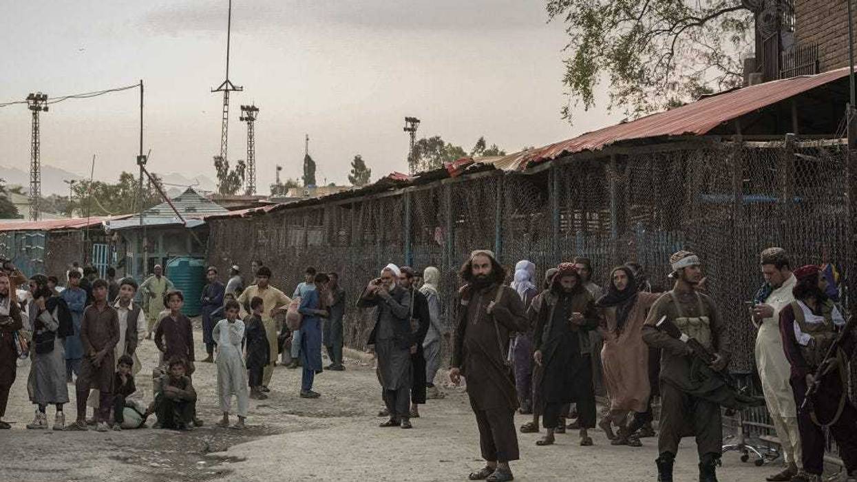 Taliban fighters guard the Afghanistan side of the Torkham crossing.