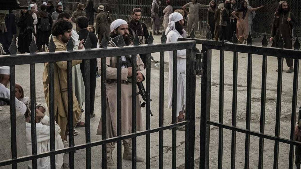 Taliban fighters guard the Afghanistan side of the Torkham crossing.