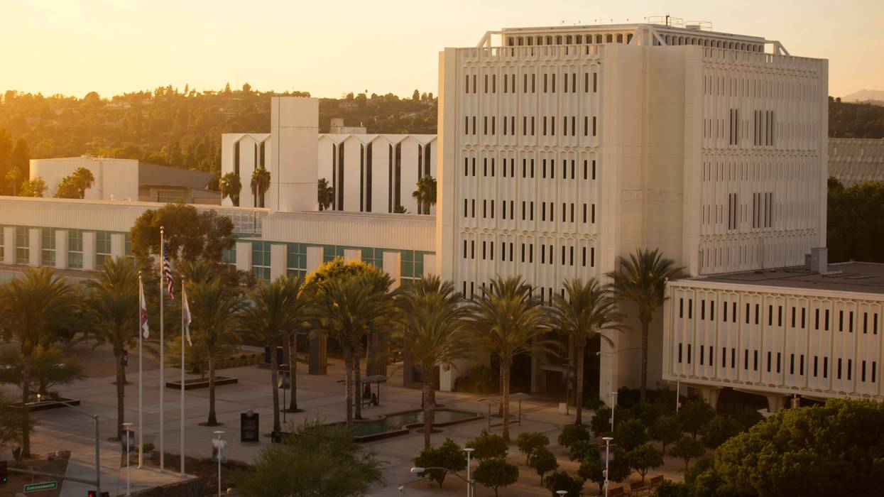 tall building on college campus at sunset